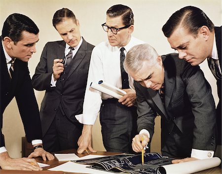 retro vintage occupations adults - 1960s BUSINESSMEN MEETING INSPECTING BLUEPRINTS Not for use with: Beer, Cigars, Cigarettes, Soap, Toothpaste, Mouthwash, Coffee, Tea, or Soft Drinks Stock Photo - Rights-Managed, Code: 846-05647277