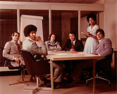 1970s BUSINESS MEETING SIX SERIOUS PEOPLE SITTING AROUND CONFERENCE TABLE Stock Photo - Rights-Managed, Code: 846-05647272