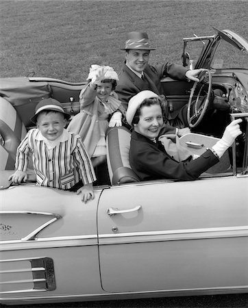 1950s SMILING FAMILY PORTRAIT MOTHER FATHER SON DAUGHTER IN CHEVROLET CONVERTIBLE AUTOMOBILE Stock Photo - Rights-Managed, Code: 846-05647642