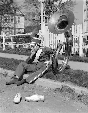 simsearch:846-06111744,k - 1950s - 1960s TEEN BOY BAND UNIFORM & TUBA SITTING ON CURB WITH SHOES OFF Stock Photo - Rights-Managed, Code: 846-05647667