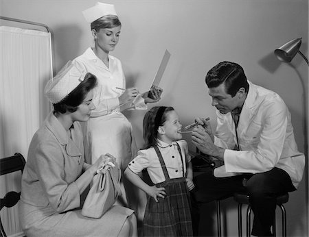 simsearch:846-02794819,k - 1960s MOTHER SITTING WATCHING MAN PEDIATRIC DOCTOR WOMAN NURSE CHECKING ON SMILING LITTLE GIRL PATIENT Stock Photo - Rights-Managed, Code: 846-05647689