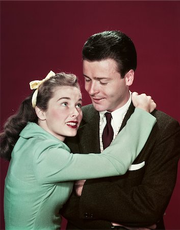 simsearch:846-05648312,k - 1940s - 1950s COUPLE WOMAN HUGGING MAN ARMS AROUND HIS SHOULDERS Stock Photo - Rights-Managed, Code: 846-05647816