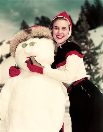 female snowman pictures - 1940s - 1950s SMILING WOMAN HOLDING CIGAR IN SNOWMAN'S MOUTH Stock Photo - Rights-Managed, Code: 846-05647878