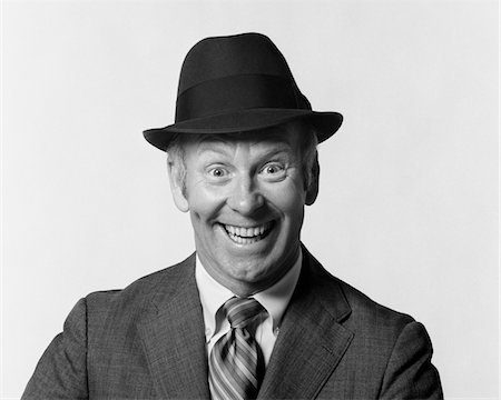 salesman hat - 1960s MAN SMILING WEARING SUIT AND HAT WITH SILLY EAGER FACIAL EXPRESSION Stock Photo - Rights-Managed, Code: 846-05647946