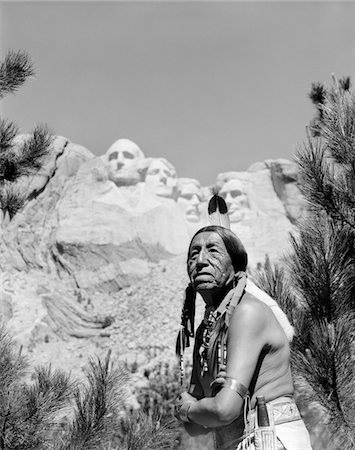 presiding - 1960s PORTRAIT OF AMERICAN INDIAN IN FRONT OF MOUNT RUSHMORE Stock Photo - Rights-Managed, Code: 846-05648058