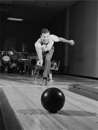 simsearch:846-06111784,k - 1960s MAN RELEASING BALL DOWN BOWLING ALLEY LANE Stock Photo - Rights-Managed, Code: 846-05648141
