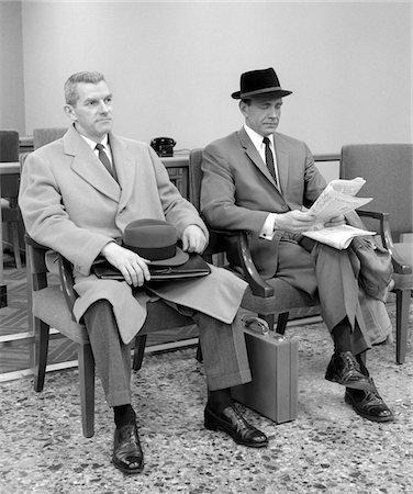 salesman hat - 1950s - 1960s TWO MEN BUSINESSMAN SALESMAN SITTING IN OFFICE RECEPTION WAITING AREA INDOOR Stock Photo - Rights-Managed, Code: 846-05648363