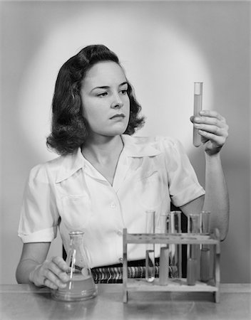 simsearch:846-02793574,k - 1940s YOUNG WOMAN CHEMIST HOLDING UP TEST TUBE Stock Photo - Rights-Managed, Code: 846-05648425