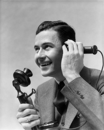 picture of person talking on string telephone - 1920s - 1930s MAN TALKING ON CANDLESTICK PHONE Stock Photo - Rights-Managed, Code: 846-05648476