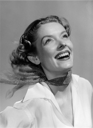 1950s SMILING PORTRAIT WOMAN WITH HEAD LEANING BACK LOOKING UPWARD & WIND BLOWING BACK HAIR & SCARF Stock Photo - Rights-Managed, Code: 846-06111817