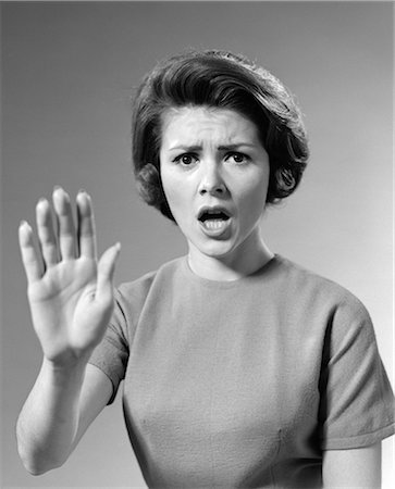 stress black & white portrait - 1960s ALARMED WOMAN HOLDING UP HER HAND TO STOP SOMETHING Stock Photo - Rights-Managed, Code: 846-06111851