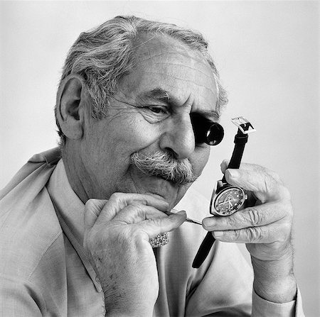1980s ELDERLY MUSTACHED MAN WITH LOUPE ON EYE & SMALL TOOL INSPECTING BACK OF WATCH FOR REPAIR Stock Photo - Rights-Managed, Code: 846-06111913