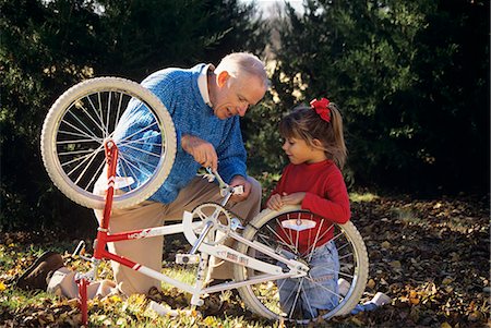 simsearch:846-06111991,k - GRANDFATHER FIXING BICYCLE FOR GRANDDAUGHTER Stock Photo - Rights-Managed, Code: 846-06112082