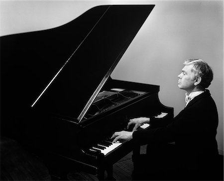 OLDER MAN WITH GRAYING HAIR IN TUXEDO PLAYING GRAND PIANO Stock Photo - Rights-Managed, Code: 846-06112132