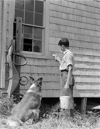 simsearch:846-05645948,k - 1930s BOY PAINTING SIDE OF FARM HOUSE WITH COLLIE SITTING BESIDE HIM WATCHING Stock Photo - Rights-Managed, Code: 846-06112278