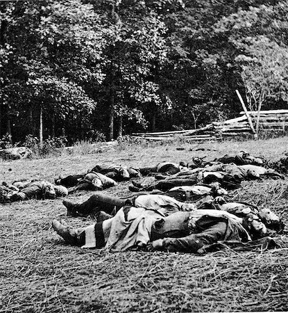 dead male - 1800s 1860s JULY 1863 MATHEW BRADY PHOTO DEAD OF THE MICHIGAN INFANTRY REGIMENT ON THE BATTLEFIELD OF GETTYSBURG PA PHOTO BY BRADY ASST. TIM O'SULLIVAN Stock Photo - Rights-Managed, Code: 846-06112316