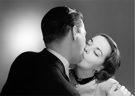 1950s CLOSE-UP OF MAN AND WOMAN KISSING Stock Photo - Rights-Managed, Code: 846-06112354