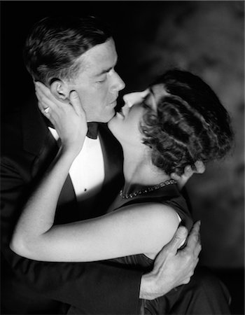 simsearch:846-05648045,k - 1920s 1930s ROMANTIC COUPLE EMBRACING ABOUT TO KISS EVENING DRESS STUDIO Stock Photo - Rights-Managed, Code: 846-06112360