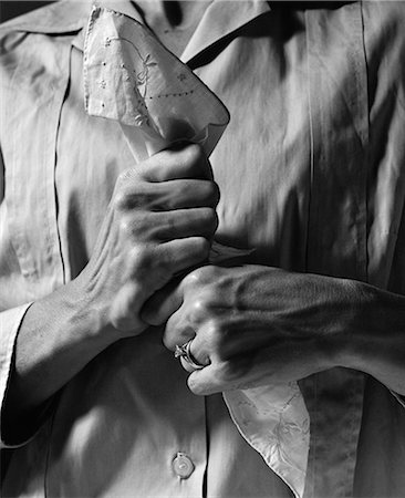 simsearch:846-03163222,k - 1960s WOMAN'S HANDS HOLDING HANDKERCHIEF TIGHTLY IN FRONT OF CHEST Stock Photo - Rights-Managed, Code: 846-06112399