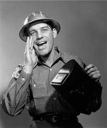 1950s 1960s MAN WORKER IN HARD HAT YELLING CARRYING LUNCH BOX Stock Photo - Rights-Managed, Code: 846-06112408