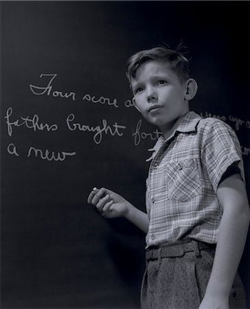 simsearch:846-06111843,k - 1940s GRADE SCHOOL BOY AT CHALKBOARD WRITING OUT GETTYSBURG ADDRESS Stock Photo - Rights-Managed, Code: 846-06112422