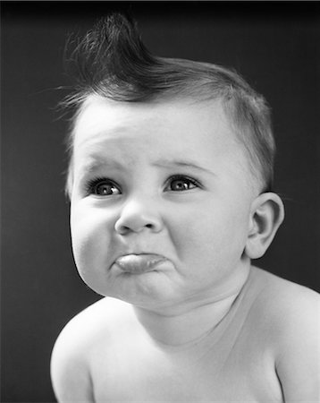 1940s 1950s SAD BABY WITH POUTING LOWER LIP EXTENDED ABOUT TO CRY Foto de stock - Con derechos protegidos, Código: 846-08140032