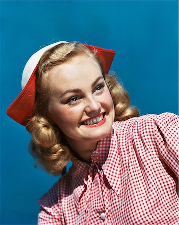 1940s 1950s PORTRAIT SMILING BLOND TEENAGE GIRL WEARING RED AND WHITE CHECKED BLOUSE AND DUTCH STYLE HAT Stock Photo - Rights-Managed, Code: 846-08140092