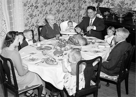 retro celebrations - 1950s THREE GENERATION FAMILY HAVING THANKSGIVING HOLIDAY MEAL IN DINING ROOM FATHER CARVING TURKEY Stock Photo - Rights-Managed, Code: 846-08226072