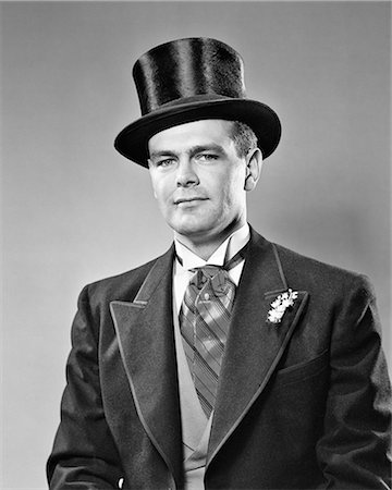 1940s 1950s PORTRAIT SERIOUS BRIDEGROOM WEARING ASCOT MORNING COAT TOP HAT PEARL STICK PIN LILY OF THE VALLEY BOUTONNIERE Foto de stock - Con derechos protegidos, Código: 846-08639483