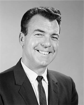 simsearch:846-08639573,k - 1960s SMILING BUSINESS MAN PORTRAIT WEARING SUIT TIE LOOKING AT CAMERA Stock Photo - Rights-Managed, Code: 846-08639566