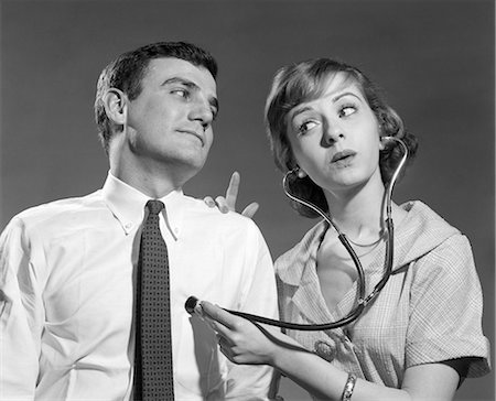 rétro - 1960s WIFE WITH STETHOSCOPE ON HUSBAND Photographie de stock - Rights-Managed, Code: 846-08639571