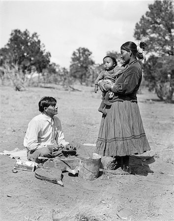 simsearch:846-09181575,k - 1930 NATIVE AMERICAN NAVAJO INDIAN MAN SILVERSMITH WITH WIFE WOMAN AND BABY CHILD Stock Photo - Rights-Managed, Code: 846-09012766