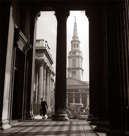 simsearch:846-03164194,k - 1930s ANONYMOUS SILHOUETTED WOMAN WALKING COLONNADE ST. MARTINS IN THE FIELD CHURCH LONDON ENGLAND Stock Photo - Rights-Managed, Code: 846-09013105