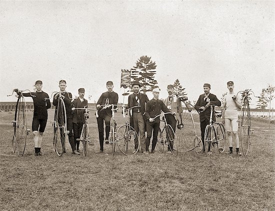 1870s 1880s 1890s NINE LATE 19TH CENTURY MEN LINED UP WITH OLD FASHIONED HIGH WHEEL PENNY-FARTHING BICYCLES LOOKING AT CAMERA Stock Photo - Premium Rights-Managed, Artist: ClassicStock, Image code: 846-09161569