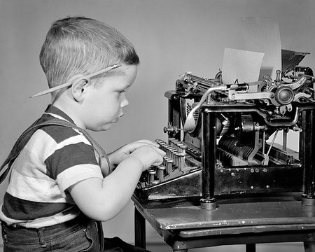 1940s BOY TYPING ON MANUAL TYPEWRITER PENCIL BEHIND HIS EAR Stock Photo - Rights-Managed, Code: 846-09181713