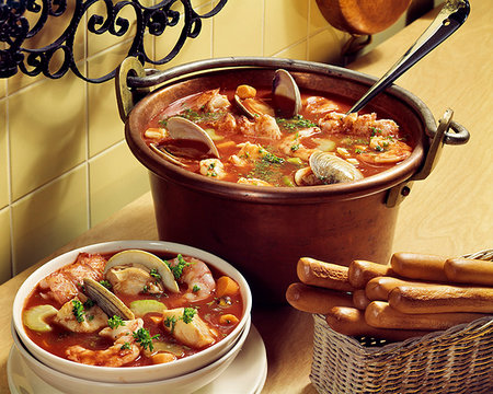 food 1980s - 1980s SEAFOOD STEW IN COPPER POT SINGLE SERVING IN A BOWL WITH BREAD STICKS ALONG SIDE Stock Photo - Rights-Managed, Code: 846-09181763