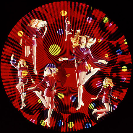 1960s 1970s MULTIPLE EXPOSURE YOUNG WOMAN DANCING LOOKING AT CAMERA WITH CIRCULAR GRAPHIC EFFECTS DISCO CLUB LIGHTSHOW Stock Photo - Rights-Managed, Code: 846-09181793