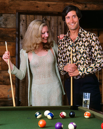 1970s COUPLE AT BILLIARD POOL TABLE IN RECREATION ROOM SPORTS MAN WOMAN Stock Photo - Rights-Managed, Code: 846-09181873