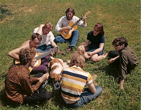 RETRO GROUP OF TEENAGERS SITTING OUTSIDE IN A CIRCLE WITH GUITARS Stock Photo - Rights-Managed, Code: 846-02794109