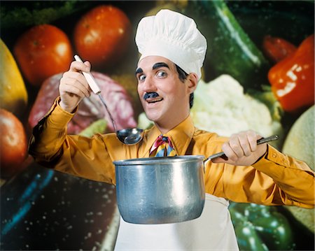 food backdrop for chef photos - 1970s FUNNY CHARACTER MAN IN CHEF HAT TOQUE HOLDING LADLE & SOUP POT VEGETABLE BACKDROP SILLY EXPRESSION COOKING SHOW Stock Photo - Rights-Managed, Code: 846-02794245