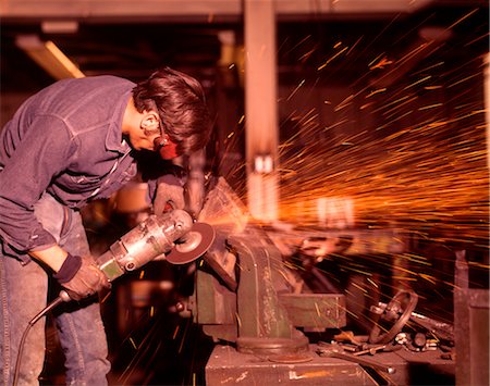 1970s MAN WORKING METAL SHOP SPARKS WELDING SANDING INDUSTRY WORKER WORKERS MEN Stock Photo - Rights-Managed, Code: 846-02794422