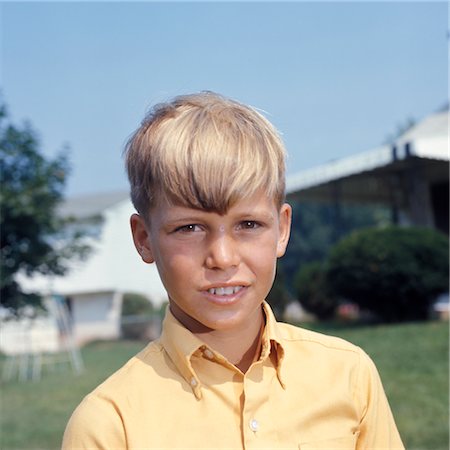 JUVENILE BOY STANDING OUTSIDE HEAD SHOT DIRTY BLOND HAIR YELLOW SHIRT Stock Photo - Rights-Managed, Code: 846-02794505