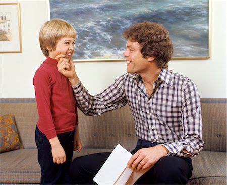 1970s FATHER AND SON LAUGHING TALKING TOUCHING COUCH MAN BOY Stock Photo - Rights-Managed, Code: 846-02794594