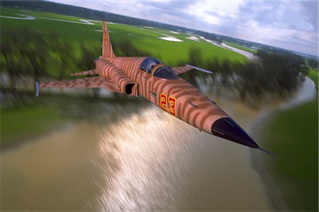 simsearch:846-03163699,k - USAF F-5E TIGER II FLYING OVER RIVER Stock Photo - Rights-Managed, Code: 846-02794644