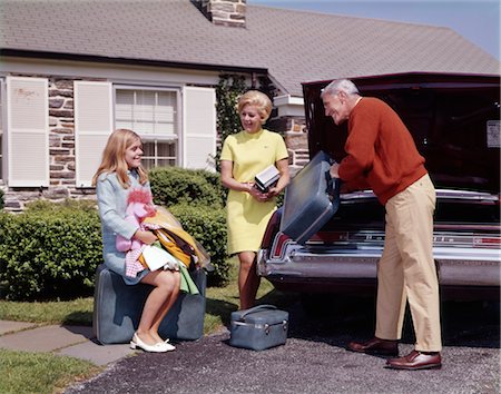 1960s FAMILY PACKING LUGGAGE INTO CAR FOR VACATION OR COLLEGE FOR DAUGHTER MAN WOMAN GIRL TEENAGE THREE HAPPY Stock Photo - Rights-Managed, Code: 846-02794726