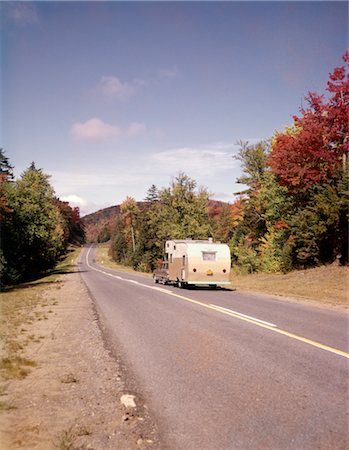 1960s CAR PULLING RV CAMPER DOWN COUNTRY ROAD ADIRONDACKS NEW YORK AUTUMN Stock Photo - Rights-Managed, Code: 846-02794848