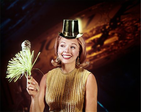 people party retro not outdoors not indoors not illustration - 1960s YOUNG BLOND WOMAN PARTY HAT NOISEMAKER HORN SMILING NEW YEAR CLOCK BACKGROUND Stock Photo - Rights-Managed, Code: 846-02794881