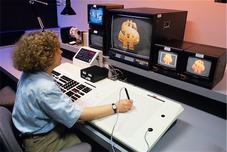 ARTIST PREPARES VIDEO GRAPHICS AT A PUBLIC BROADCASTING TV STATION Fotografie stock - Rights-Managed, Codice: 846-02794921