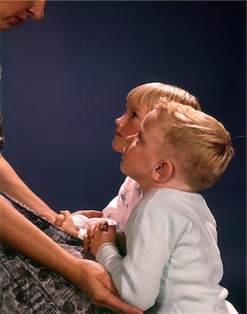 1960s TWO CHILDREN BOY GIRL KNEEL KNEELING MOTHERS LAP SAYING PRAYERS LOOKING UP FAMILY RELIGION Stock Photo - Rights-Managed, Code: 846-02795063