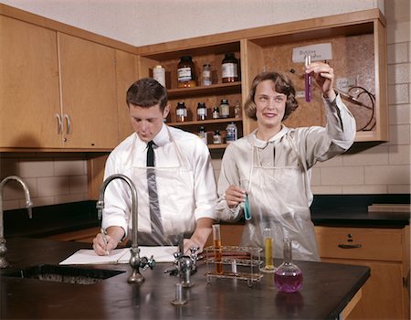 simsearch:846-02796432,k - 1960s GIRL AND BOY COLLEGE STUDENTS IN SCIENCE LAB Stock Photo - Rights-Managed, Code: 846-02795104